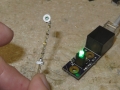 A Showcase Miniatures searchlight connected to the LED board by fiber optics
