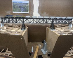 The first test train crosses the bridge. I can't wait until I have the gorge profile roughed in.