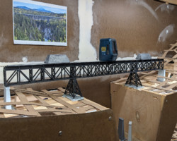 Attaching ties and rail, again with lead weights holding things down (and the laser).