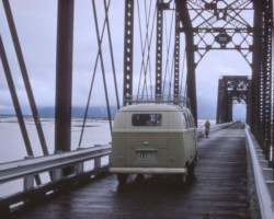 Looking northeast on the Hot Cake Channel bridges after they were converted to highway use, somewhere between 1956-1964.  The VW bus is marked "Windsor Hotel".